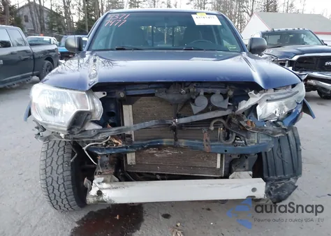 2015 Toyota Tacoma Base V6 z USA, uszkodzony, nr VIN 5TFUU4EN5FX115971